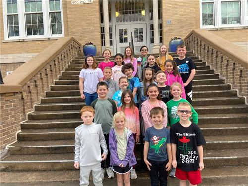 group of elementary students on stairs